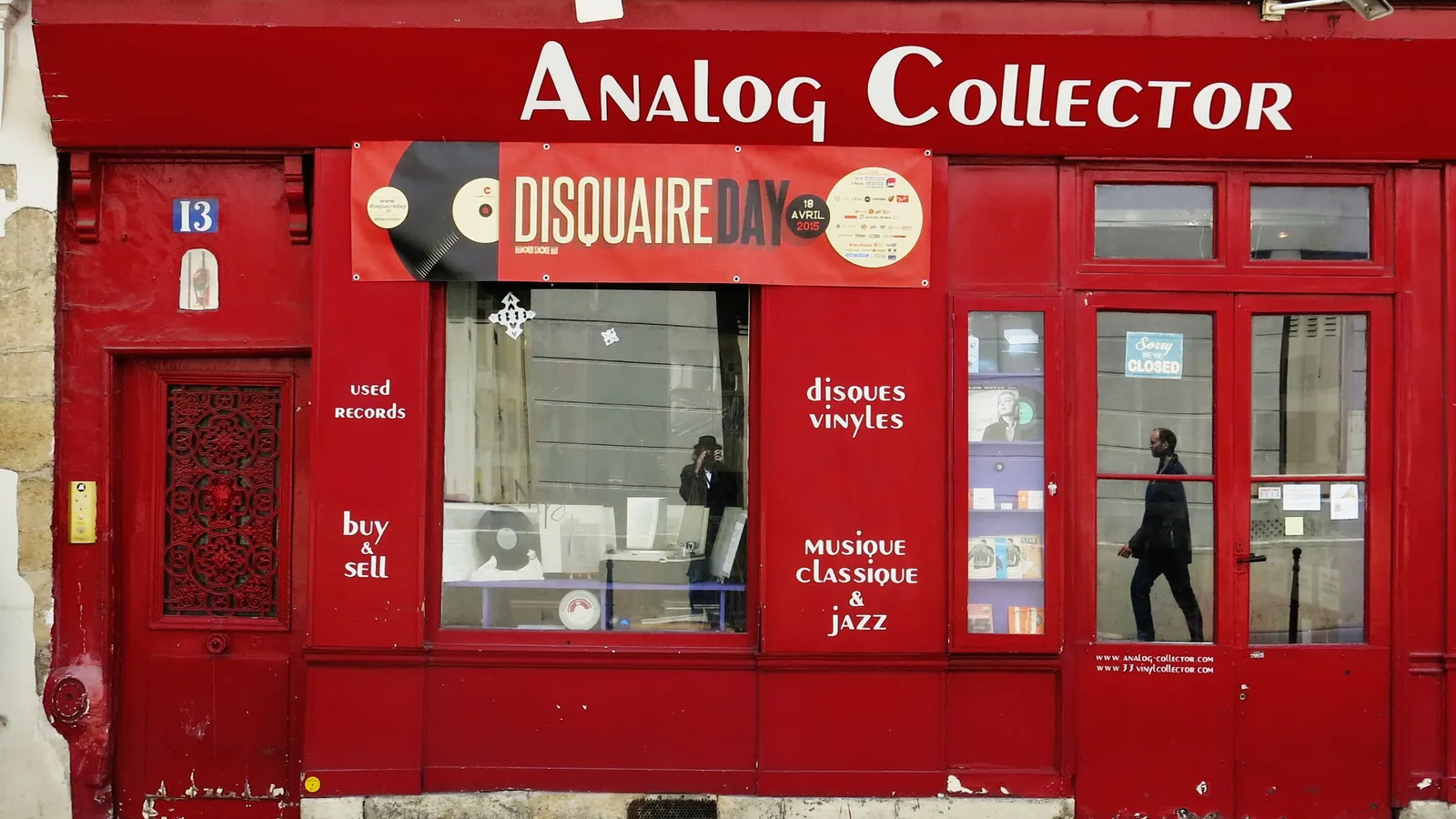 Red shopfront of the Analog Collector record shop in Paris, with used-records and vinyl signage