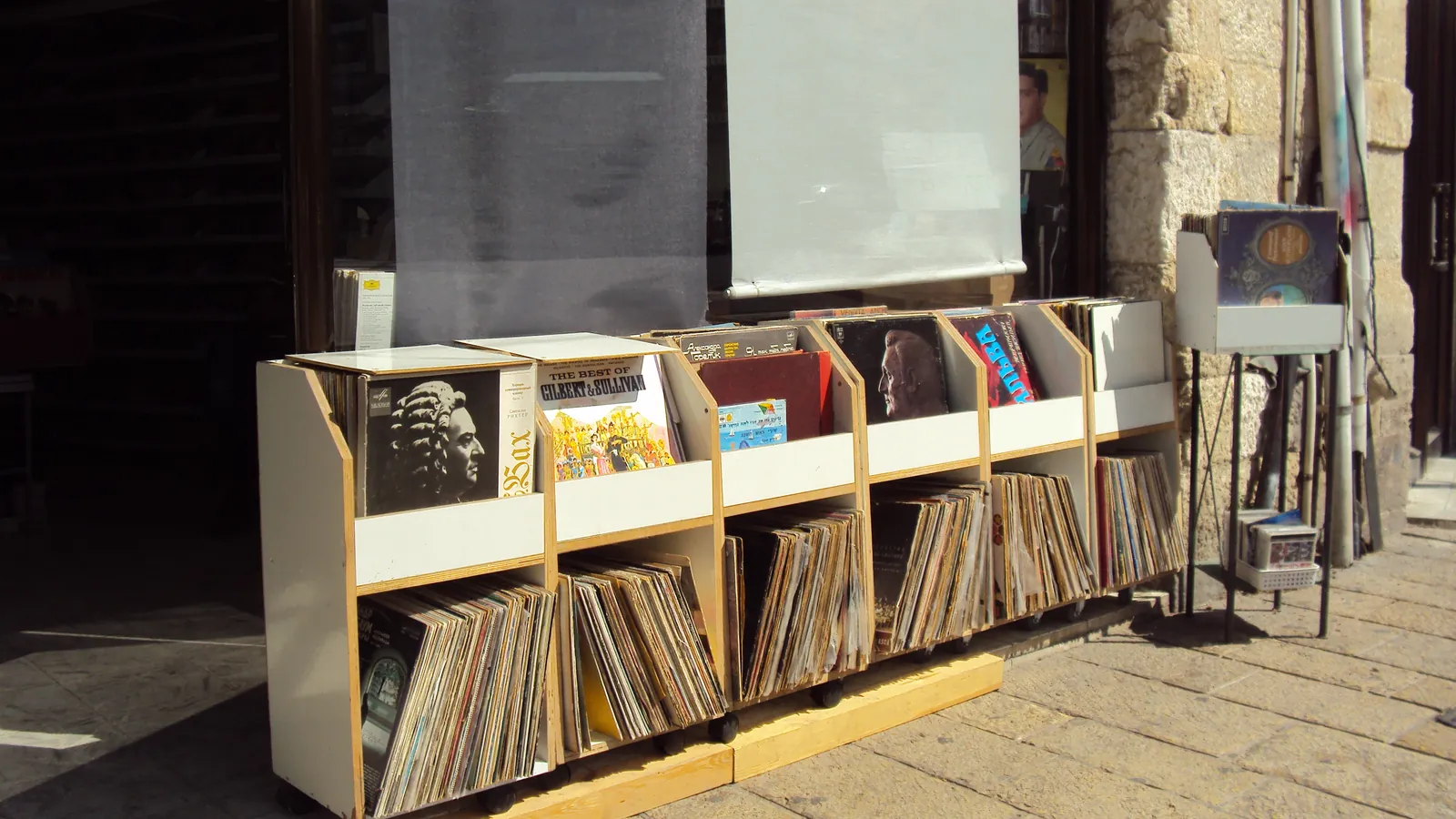 Interior of a record shop with crates and shelves of vinyl for collectors to browse