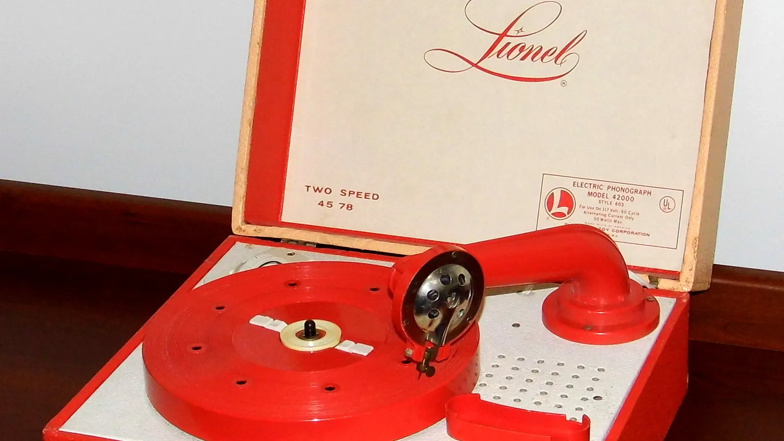 A vintage portable toy phonograph record player